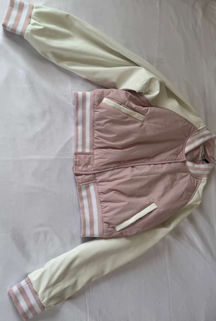 Vigoss Pink Jacket is both fashionable and practical for everyday wear.