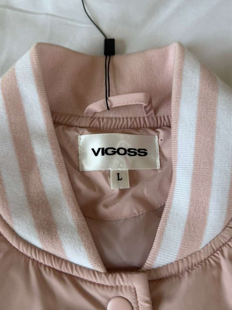 Vigoss Pink Jacket is both fashionable and practical for everyday wear.