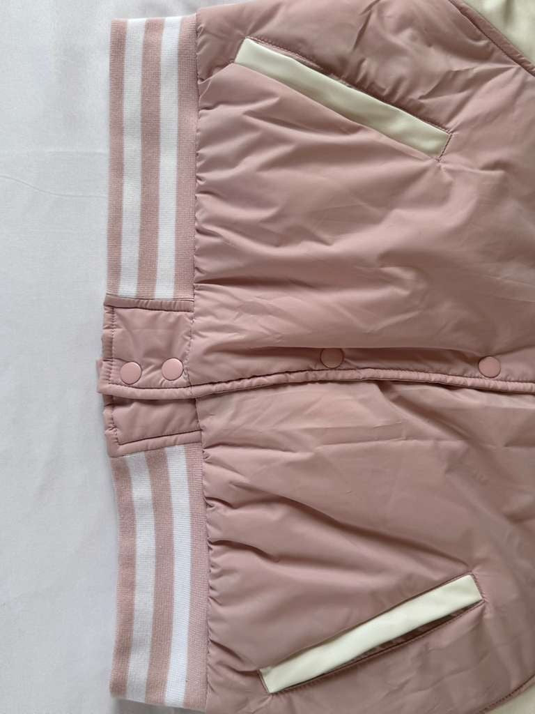 Vigoss Pink Jacket is both fashionable and practical for everyday wear.