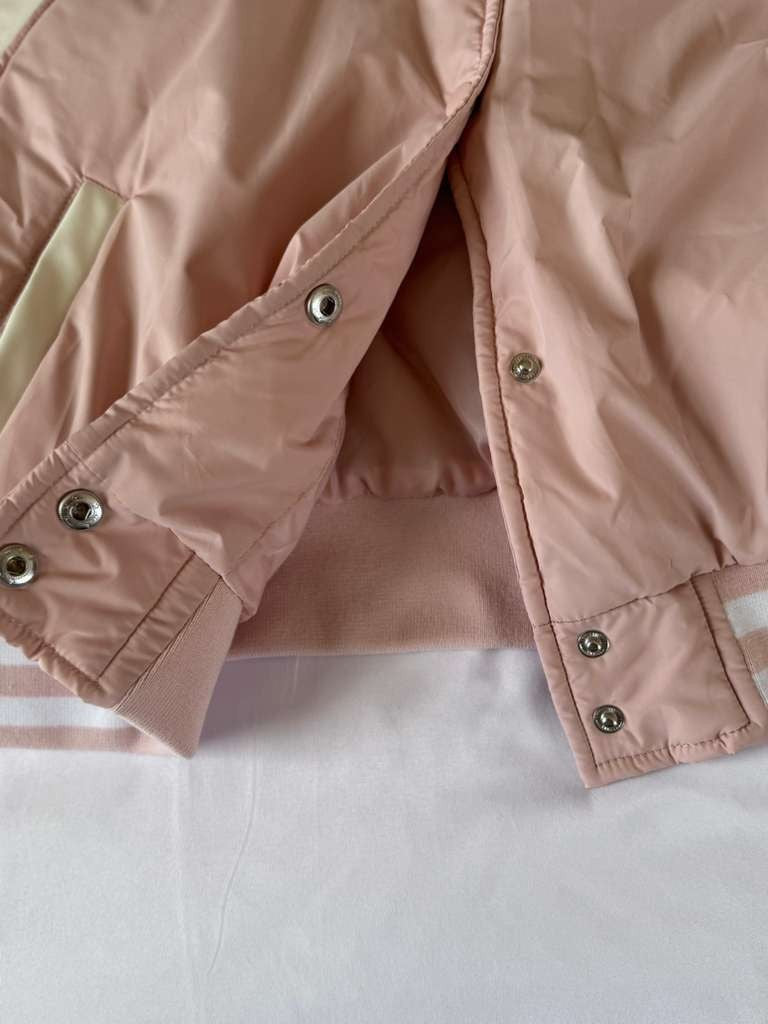 Vigoss Pink Jacket is both fashionable and practical for everyday wear.
