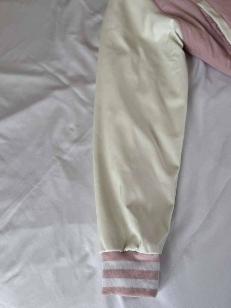 Vigoss Pink Jacket is both fashionable and practical for everyday wear.