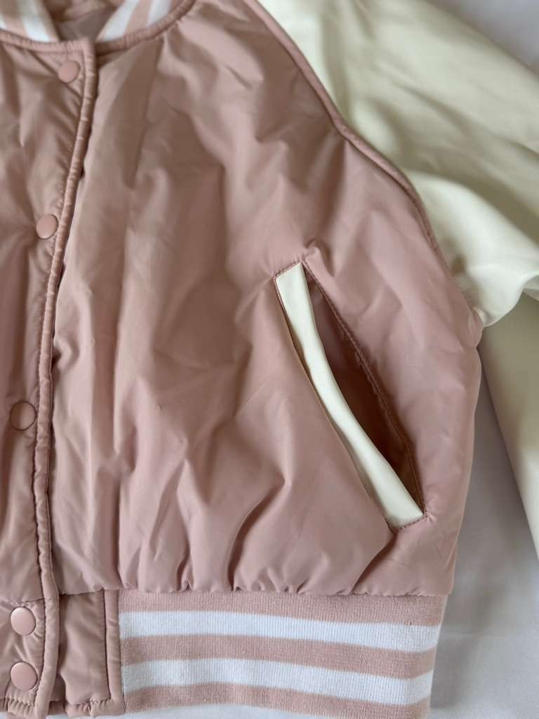 Vigoss Pink Jacket is both fashionable and practical for everyday wear.