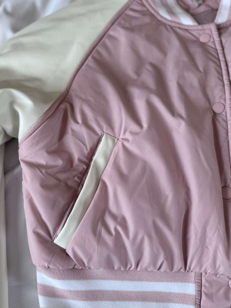 Vigoss Pink Jacket is both fashionable and practical for everyday wear.